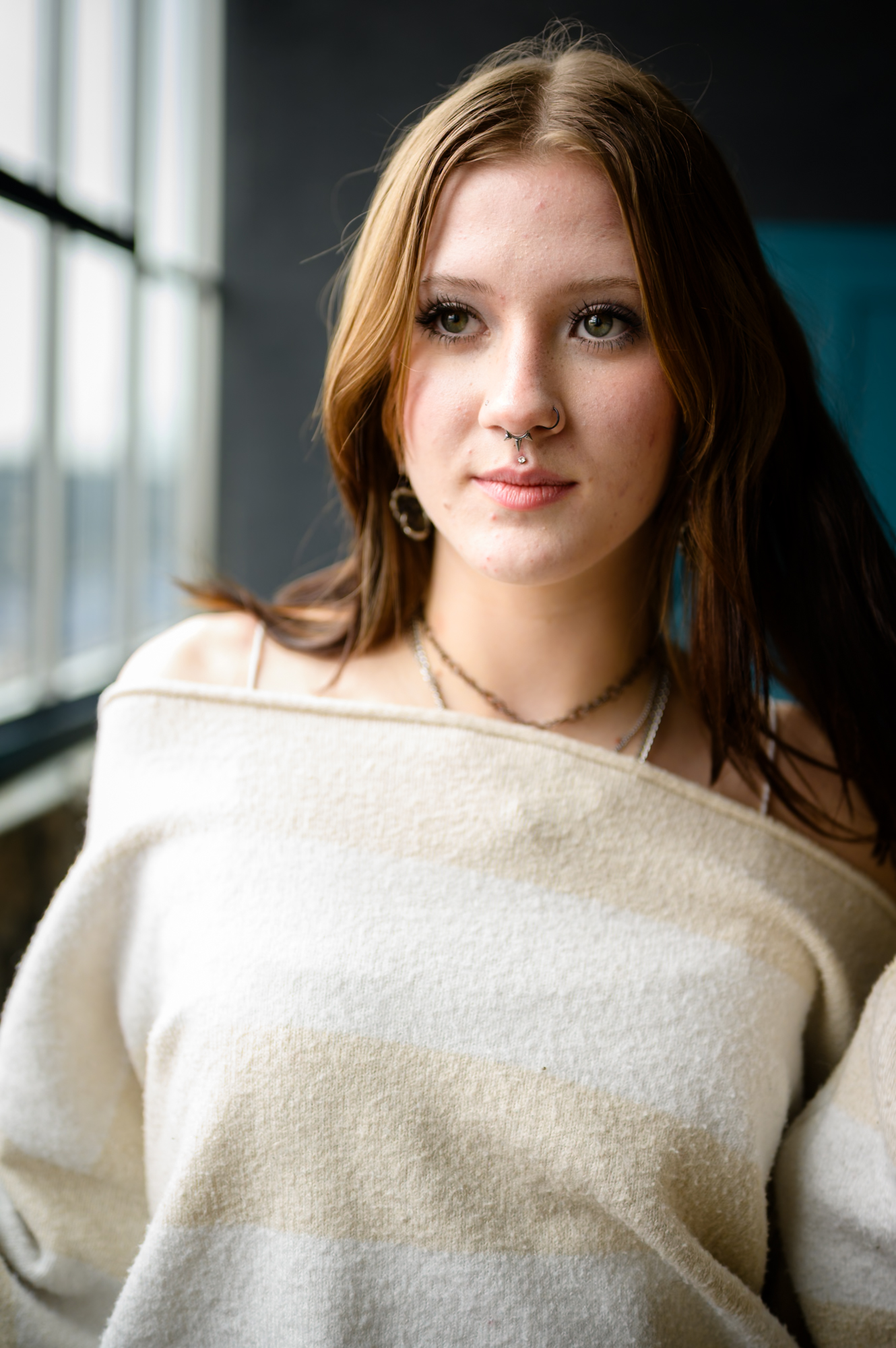 Portrait — young woman, soft window light, direct gaze