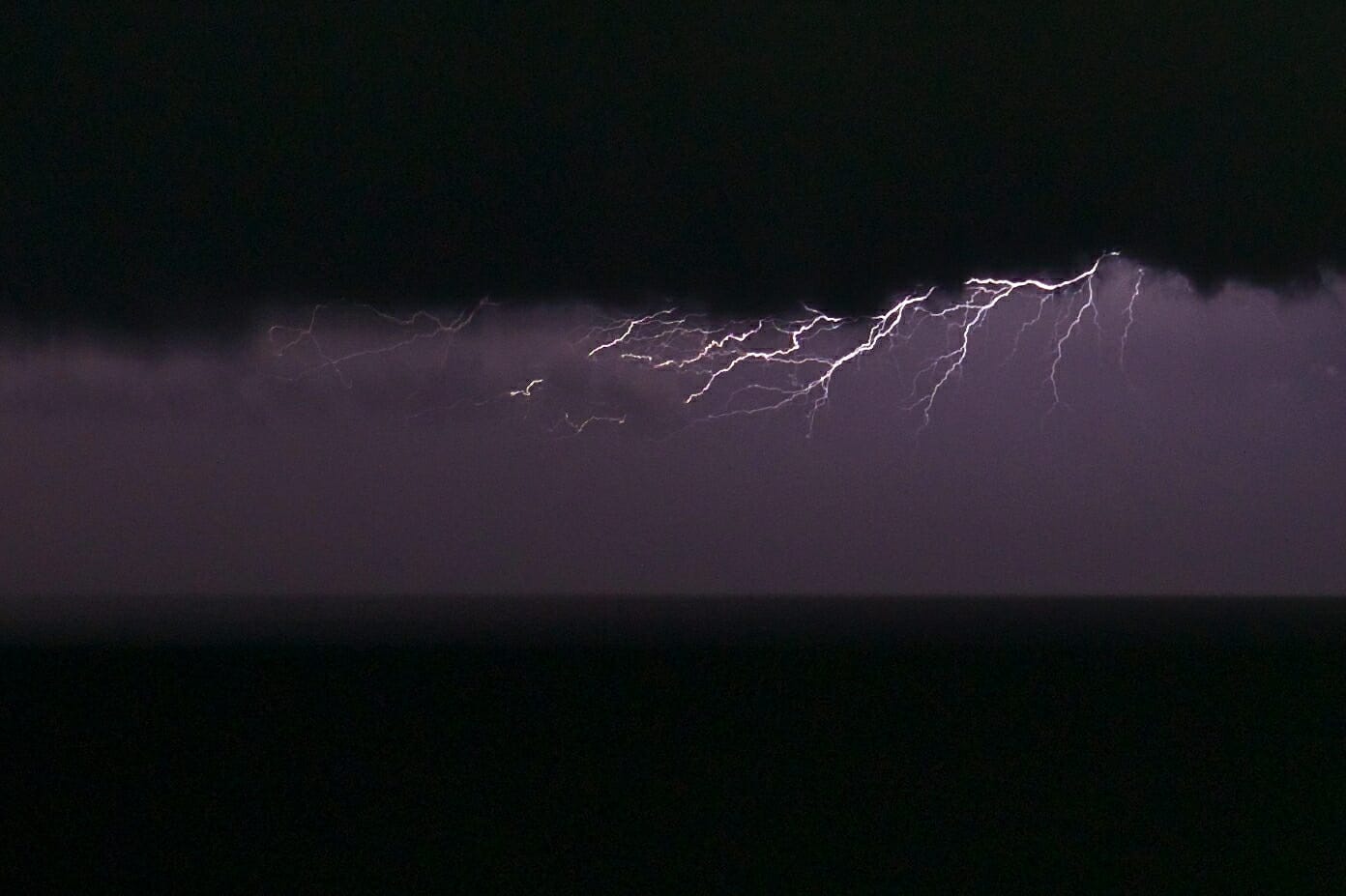 lightning at night on the horizon